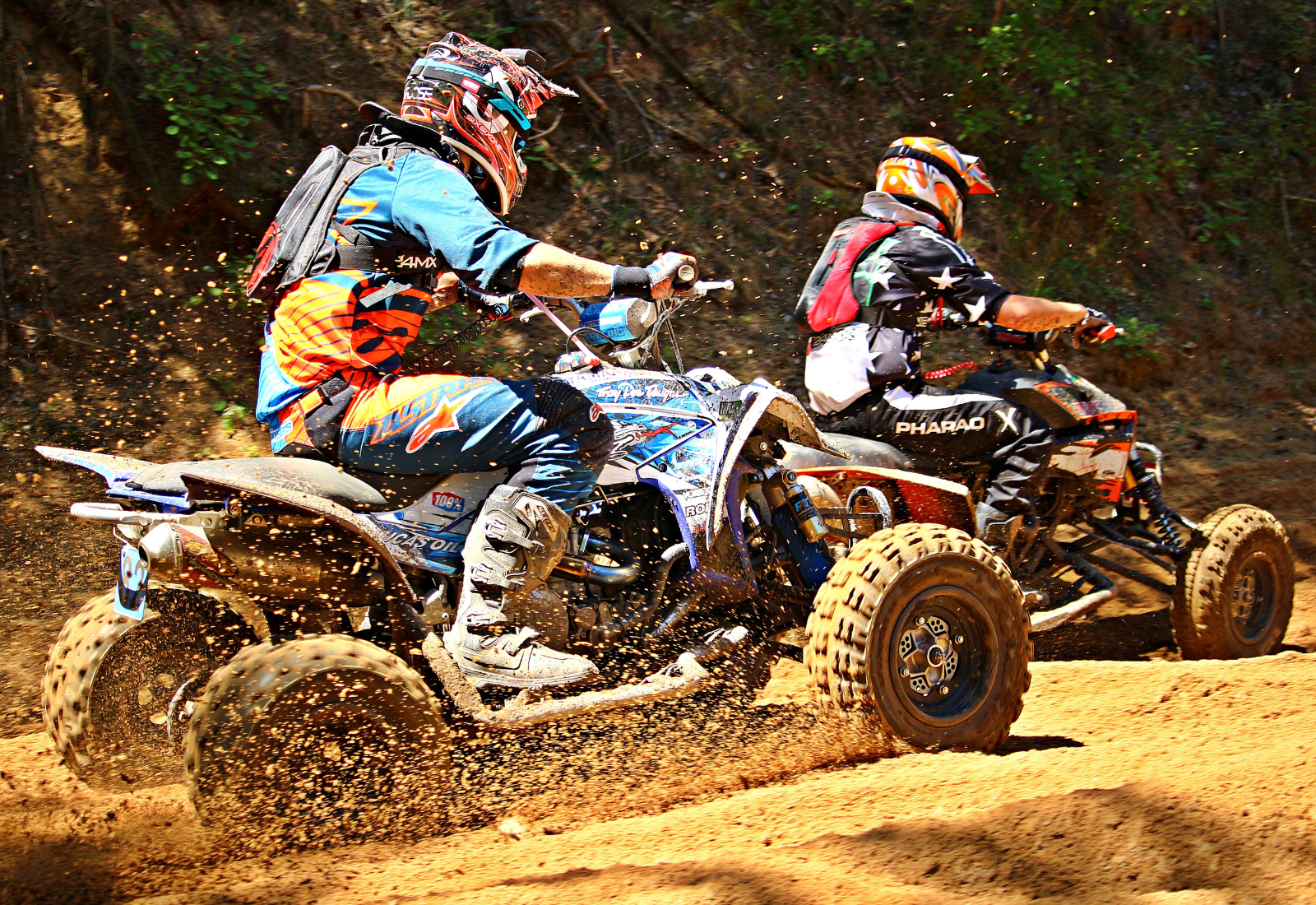 ATVs racing in the dirt